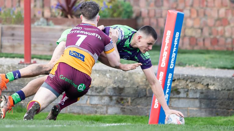 Picture by Allan McKenzie/SWpix.com - 23/03/2024 - Rugby League - Betfred Challenge Cup Round 6 - Batley Bulldogs v Castleford Tigers - Heritage Road, Batley, England - Batley's Robbie Butterworth can't prevent Castleford's Innes Senior from scoring a try.