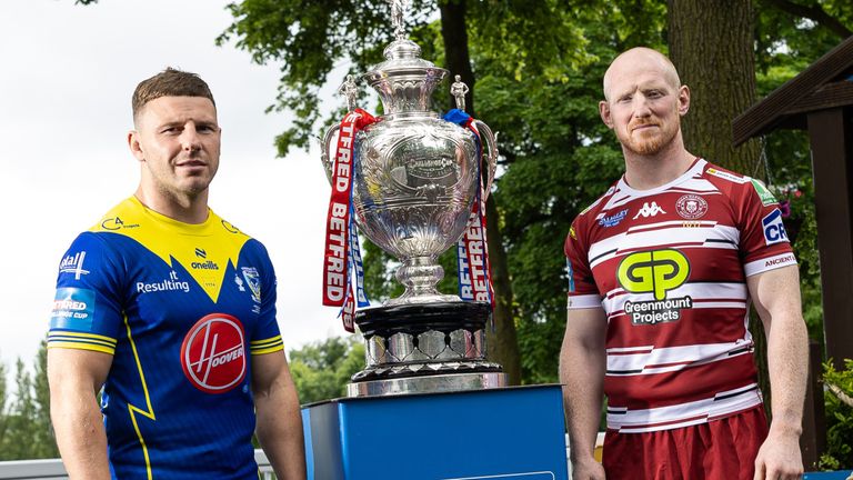 Picture by Alex Whitehead/SWpix.com - 03/06/2024 - Rugby League - Betfred Challenge Cup Final Press Conference - Haydock Park Racecourse, Merseyside, England - Warrington captain George Williams and Wigan captain Liam Farrell pictured with the Betfred Challenge Cup trophy ahead of the final on Saturday.