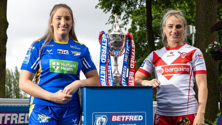 Picture by Alex Whitehead/SWpix.com - 03/06/2024 - Rugby League - Betfred Challenge Cup Final Press Conference - Haydock Park Racecourse, Merseyside, England - Leeds captain Caitlin Beevers and St Helens captain Jodie Cunningham pictured with the Betfred Women’s Challenge Cup trophy ahead of the final on Saturday.