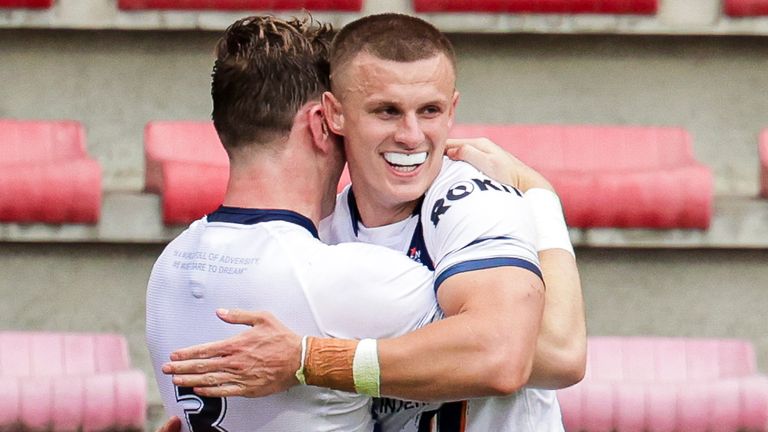 Picture by Alex Whitehead/SWpix.com - 29/06/2024 - Rugby League - International Test - France vs England - Stade Ernest-Wallon, Toulouse, France - Ash Handley of England celebrates with Harry Newman after scoring a try.