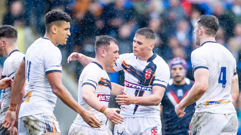 Picture by Allan McKenzie/SWpix.com - 29/04/2023 - Rugby League - Rugby League Mid-Season International - England v France - Halliwell Jones Stadium, Warrington, England - England's Harry Smith is congratulated on his try against France.