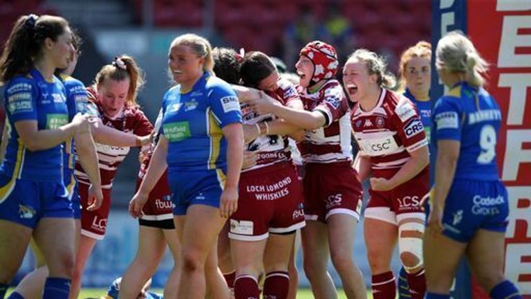 Wigan Warriors' Jade Gregory-Haselden celebrates with teammates after scoring their sides third try during the Betfred Women's Challenge Cup semi-final match at the Totally Wicked Stadium, St Helens.