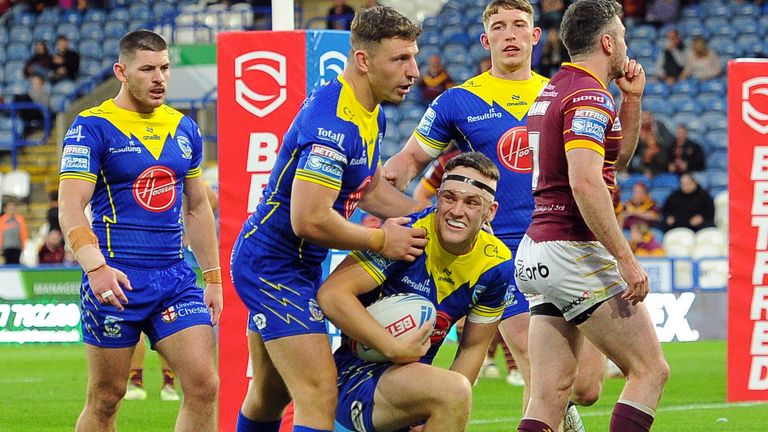 Picture by John Rushworth/SWpix.com - 14/09/2024 - Rugby League - Betfred Super League Round 26 - Huddersfield Giants v Warrington Wolves - John Smith's Stadium, Huddersfield, England - Warrington Wolves' Josh Thewlis (kneeling) celebrates scoring his sides seventh try